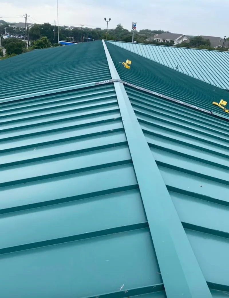 Green commercial metal roof ridge and valley for Metal Roof Repair in Savage